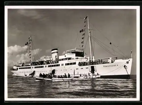 AK Salondampfer MS Königin Luise in Flaggengala vor Anker liegend, Beiboote