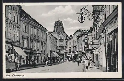 AK Wels, Bäckergasse, Lederhandlung, Hotel Post, Hotel, Geschäfte, Leute, Radfahrer