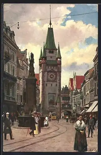 Künstler-AK Carl Münch: Freiburg / Breisgau, Kaiserstrasse mit Martinstor, Strassenbahn