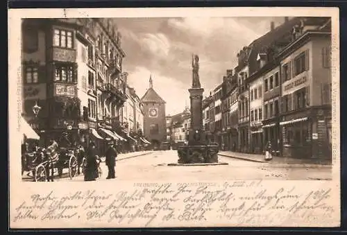 AK Freiburg i. B., Kaiserstrasse mit Geschäften und Brunnen