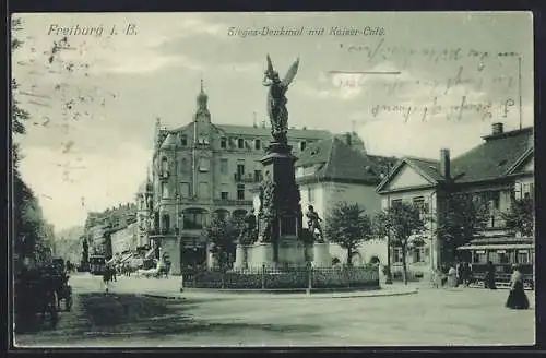 AK Freiburg i. B., Sieges-Denkmal mit Kaiser-Café und Strassenbahn