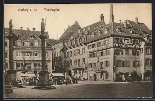 AK Freiburg i. Br., Münsterplatz mit Geschäften