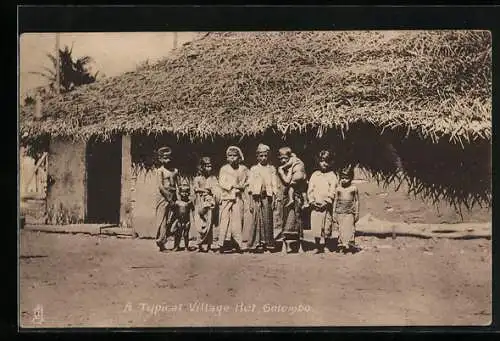 AK Indigenous kids in front of a typical village hut