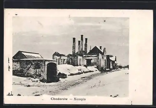 AK Chodorów, Strassenpartie mit Fabrikgebäude im Winter