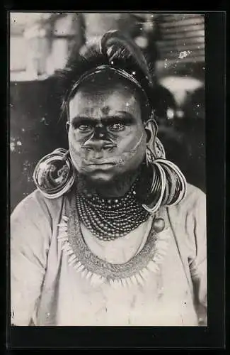 AK Indigenous Malay man with earrings and pierced nose