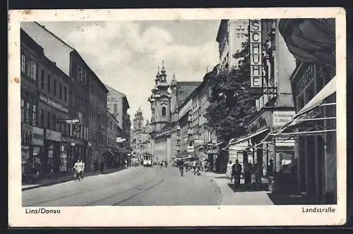 AK Linz a. D., Landstrasse mit Strassenbahn und Passanten