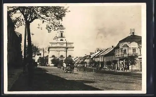 AK Poprad, Strassenpartie mit Kirche und Tankstelle