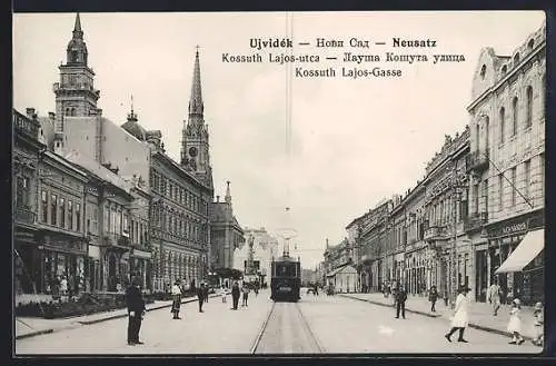 AK Ujvidék, Neusatz, Kossuth Lajos-Gasse mit Kirche und Strassenbahn