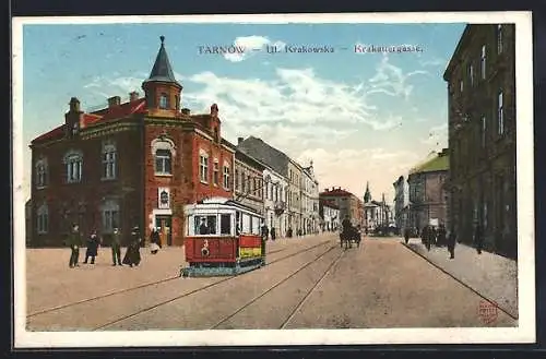 AK Tarnow, Krakauergasse mit Strassenbahn und Turmgebäude