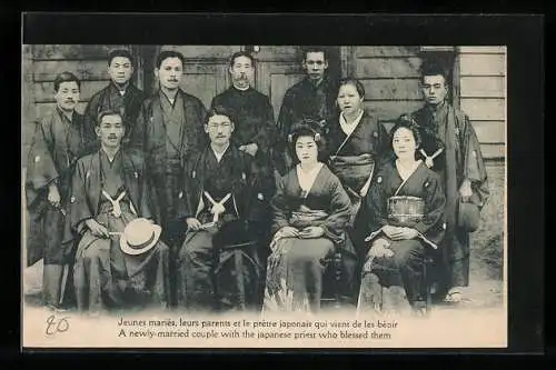 AK A newly married couple with the japanese priest who blessed them