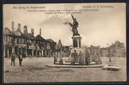 AK Neidenburg, Der Krieg in Ostpreussen, Kriegerdenkmal mit zerstörten Gebäuden ringsrum