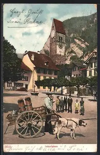 AK Interlaken, Mann mit Karren und Zughund vor einer Kirche