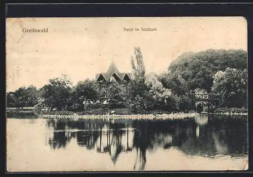 AK Greifswald, Stadtpark-Partie mit Gebäude und Brücke