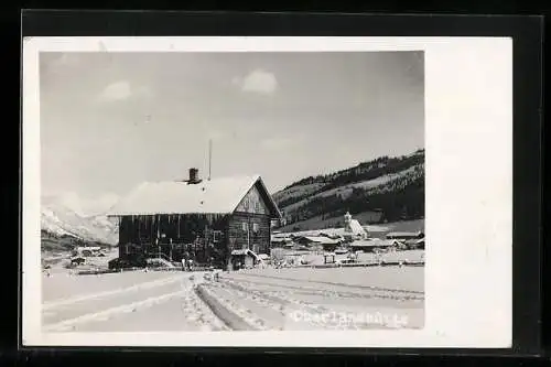 AK Oberlandhütte, Verschneite Ansicht vor der Ortschaft