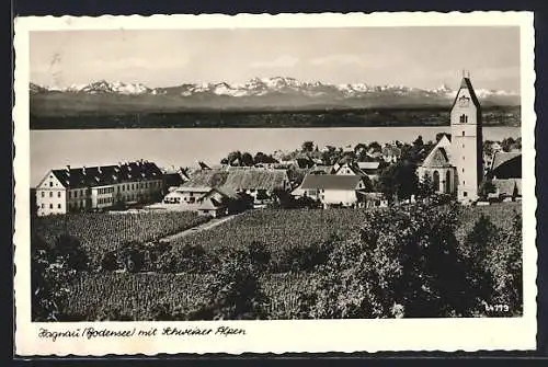 AK Hagnau /Bodensee, Teilansicht mit Kirche und Schweizer Alpen