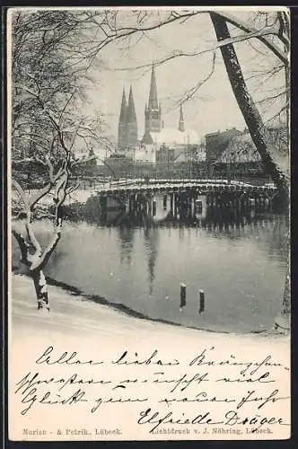 AK Lübeck, Verschneite Uferpartie mit Kirche