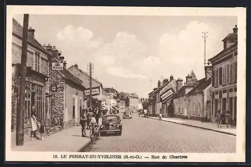 AK Le Perray-en-Yvelines, Rue de Chartres animée avec commerces et passants