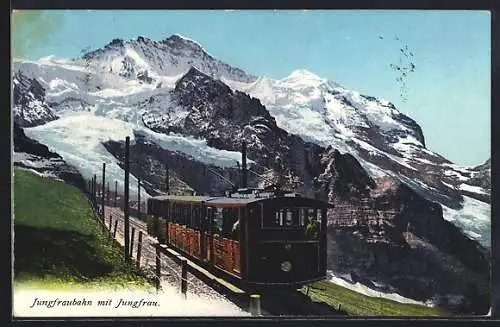 AK Jungfraubahn in Fahrt mit Jungfrau