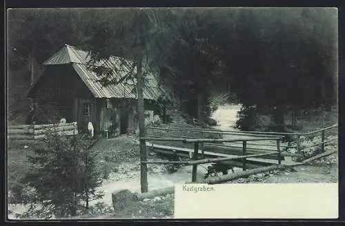 AK Karlgraben, Holzhaus an einem Fluss mit Brücke