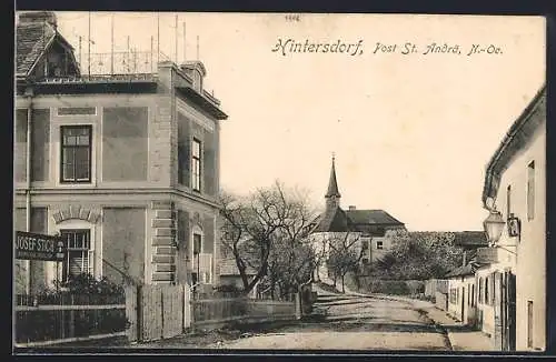 AK St. Andrä-Wördern, Hintersdorf, Strassenpartie mit Hof von Josef Stich und Kirche