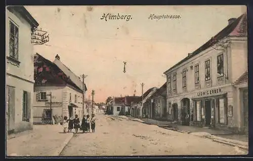 AK Himberg /N.-Oe., Hauptstrasse mit Geschäft von Ludwig Erber