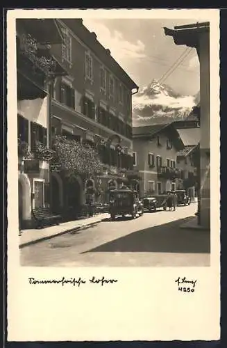 AK Lofer, Strassenpartie mit Autos am Hotel Bräu