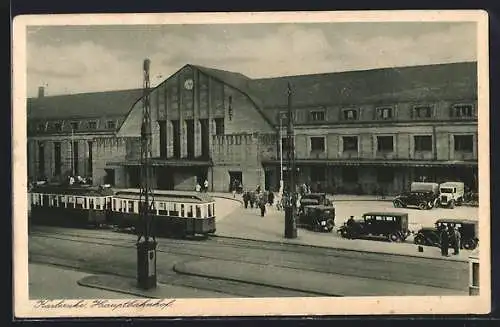 AK Karlsruhe, Parkplatz und Strassenbahn vor dem Hauptbahnhof