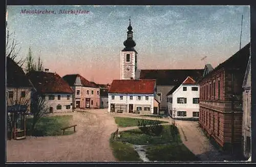 AK Mooskirchen, Marktplatz mit Kirche im Abendrot