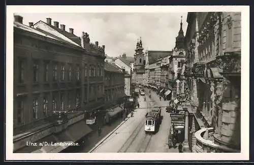 AK Linz a. d. Donau, Landstrasse mit Strassenbahn