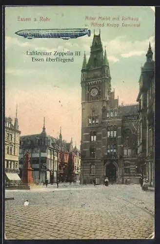 AK Essen a. Ruhr, Zeppelin III über altem Markt mit Rathaus und Krupp Denkmal