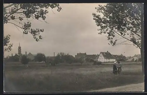 Foto-AK Heusenstamm, Ortspartie mit Kirche