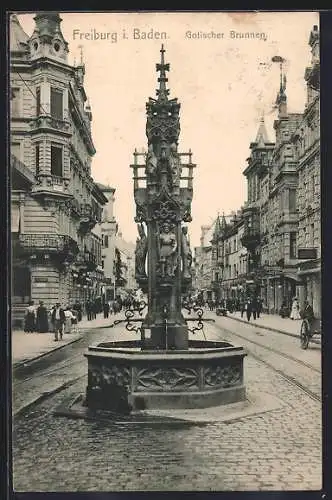 AK Freiburg / Breisgau, Gotischer Brunnen mit Strassenblick