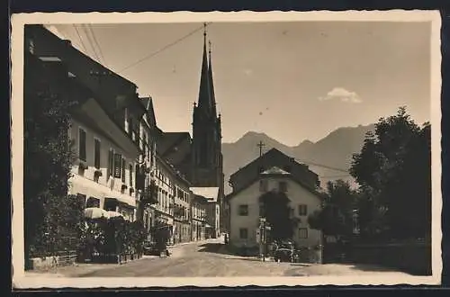 AK St. Johann im Pongau, Strassenpartie mit Kirche