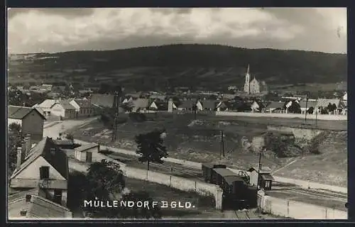 AK Müllendorf /Bgld., Panorama mit Kirche und Strassenpartie