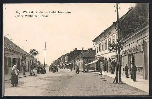 AK Ung. Weisskirchen, Kaiser Wilhelm Strasse mit Geschäften