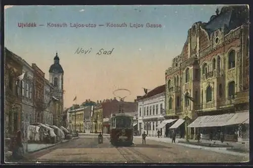 AK Kossuth, Lajos Gasse mit Strassenbahn und Geschäften, Turm