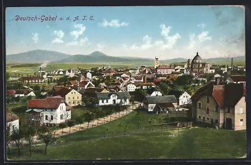 AK Deutsch-Gabel, Teilansicht mit Kirche und Feldweg