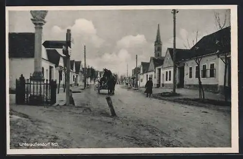 AK Unterpullendorf, Strassenpartie mit Kirche und Denkmal