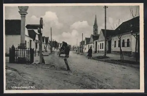 AK Unterpullendorf, Strassenpartie mit Kirche und Denkmal