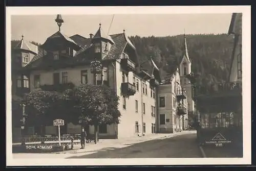 AK Schladming, Strassenpartie mit Schild zur Autogarage