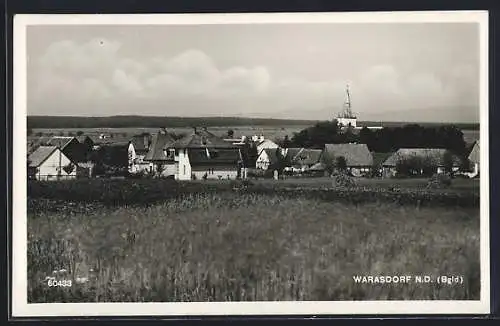 AK Warasdorf /Burgenland, Ortspanorama mit Kirche von einem Acker aus