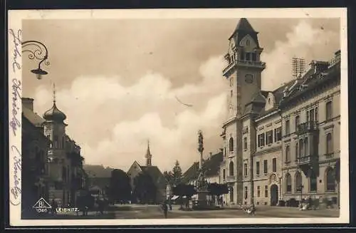 AK Leibnitz, Strassenpartie mit Kirche und Denkmal