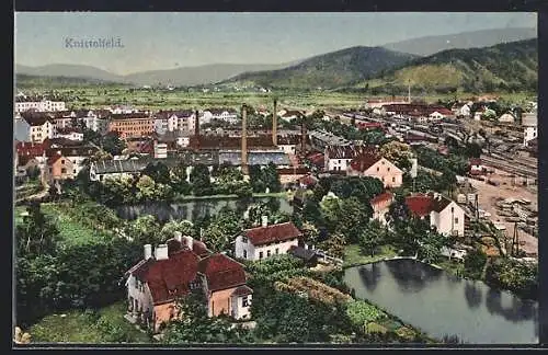 AK Knittelfeld, Ortsansicht mit Fabrik und Bergpanorama