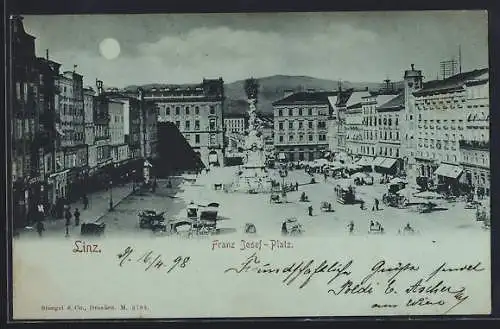 Mondschein-AK Linz, Franz Josef-Platz mit Denkmal