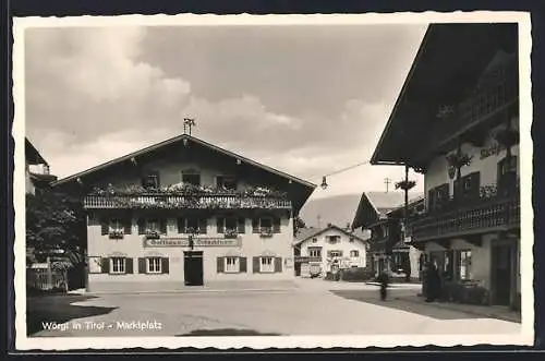 AK Wörgl, Marktplatz mit Gasthaus Schachtner