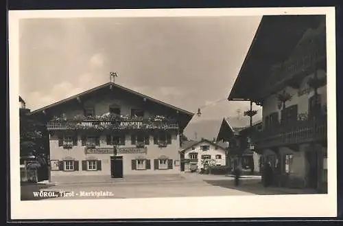 AK Wörgl, Marktplatz mit Gasthaus Schachtner