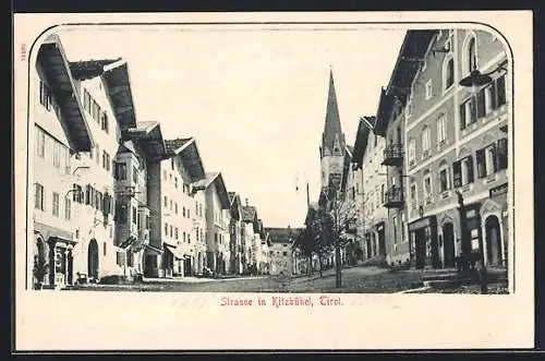 AK Kitzbühel, Strassenpartie mit Geschäften und Blick zum Kirchturm