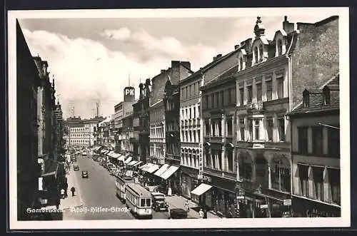 AK Saarbrücken, Strasse mit Strassenbahn und Geschäften