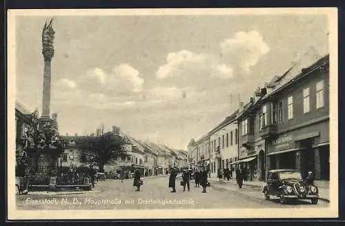 AK Eisenstadt, Hauptstrasse mit Dreifaltigkeitssäule, Geschäft von Ignaz König, Leute auf der Strasse