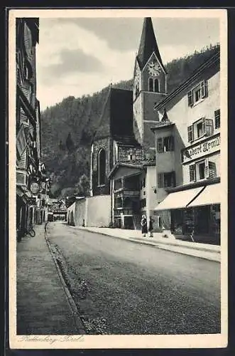 AK Rattenberg, Strassenpartie mit Kirche und Geschäften